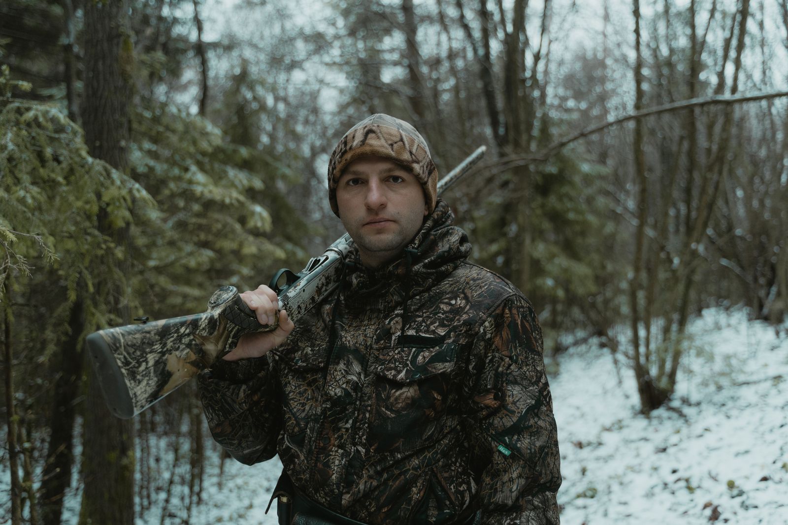 Hunter wearing full camouflage clothing